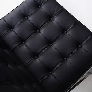 Fauteuil Lounge & Repose-Pieds – Cuir Véritable Noir et Structure Chromée Sculpturale